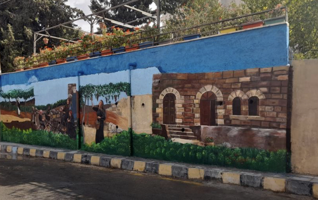بنك الإسكان يدعم مشروع جمعية بيت التراث والفنون  لرسم جداريات الفحيص الفنية